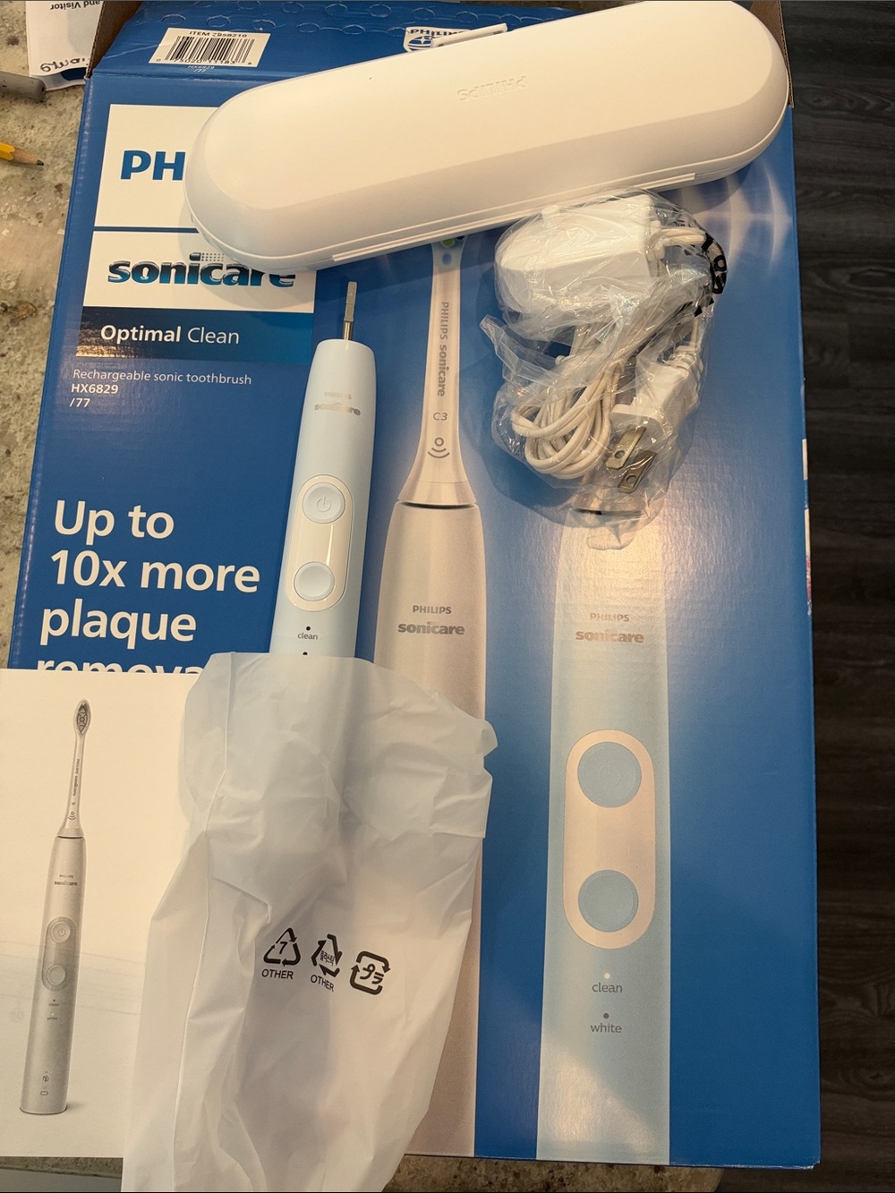 Sonicare toothbrush with case, charging base and one head. Brand new.